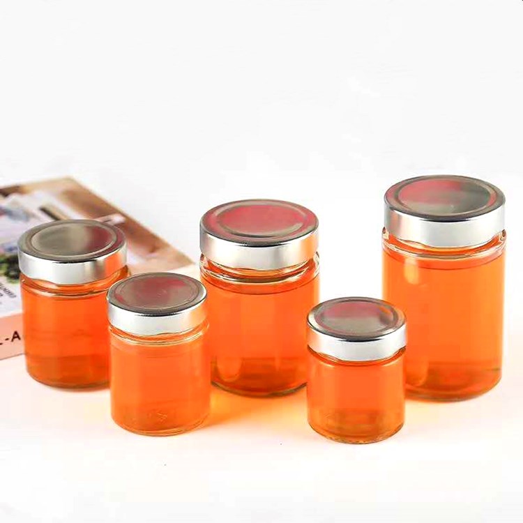 wholesale 100ml-500ml clear round straight side glass honey jars with metal lid