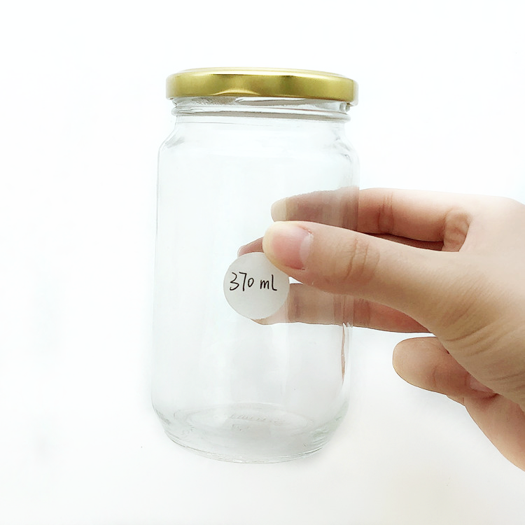 wholesale 370ml clear round glass container honey jar with metal lug cap