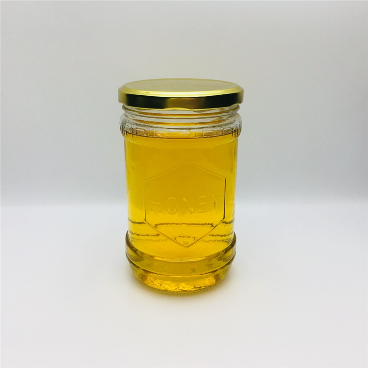 600ml 700g embossed with honey logo glass honey jar hot sale In the Middle East