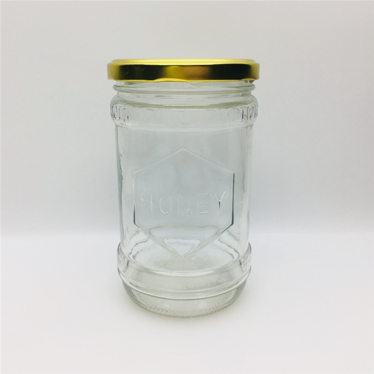 600ml 700g embossed with honey logo glass honey jar hot sale In the Middle East