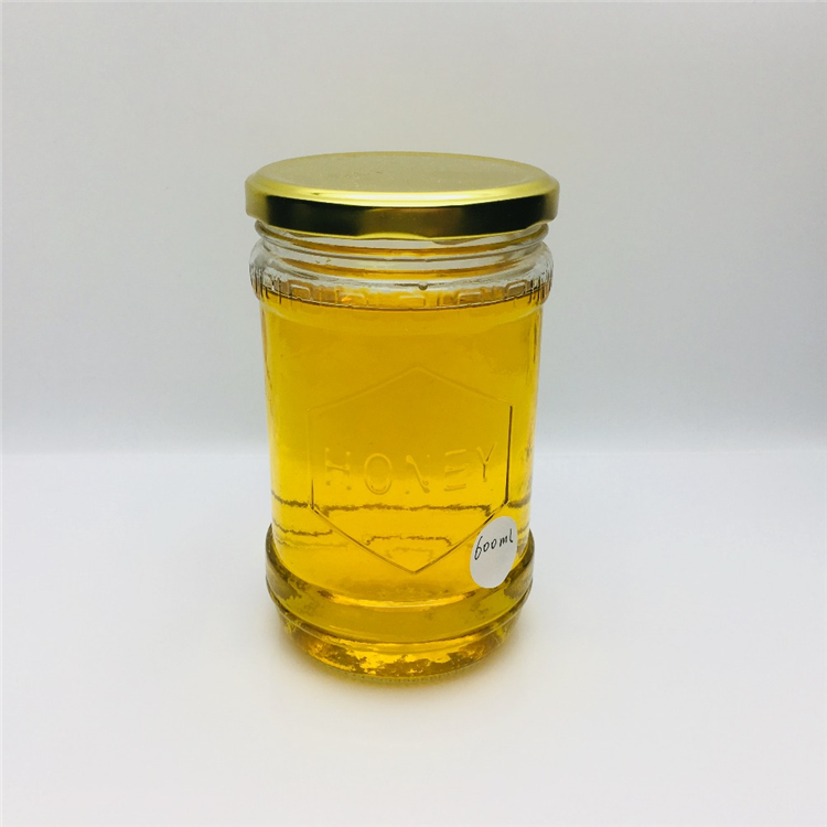 600ml 700g embossed with honey logo glass honey jar hot sale In the Middle East