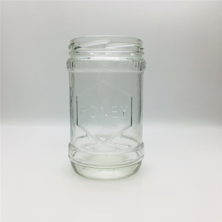 600ml 700g embossed with honey logo glass honey jar hot sale In the Middle East