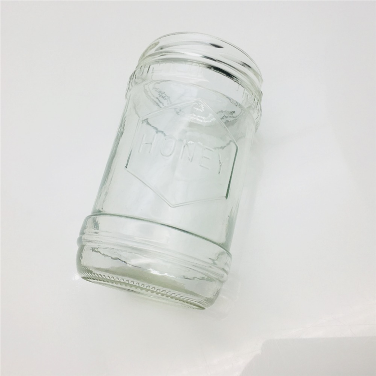 600ml 700g embossed with honey logo glass honey jar hot sale In the Middle East