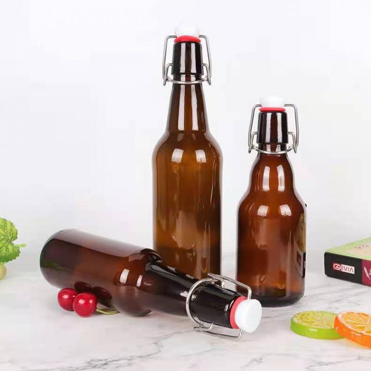 Wholesale amber glass beverage bottle with swing lid