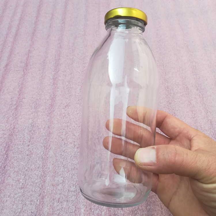 factory price 500ml clear glass drink bottle with lid wholesale