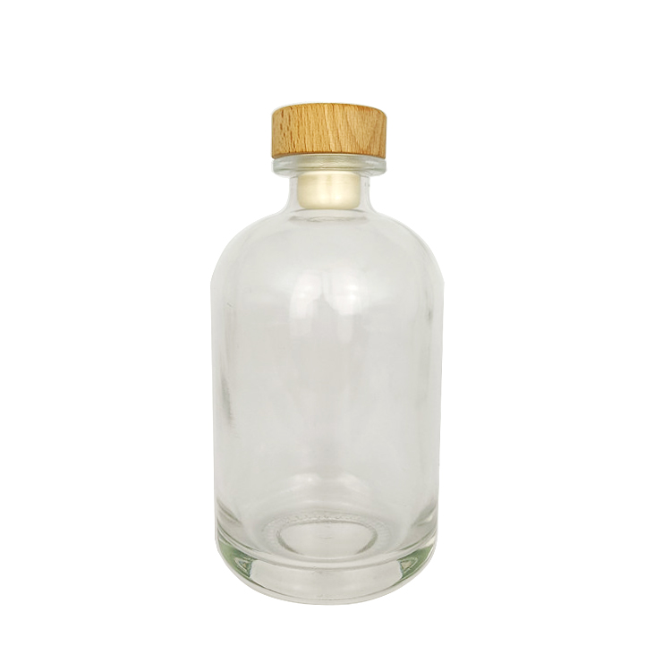 Wholesale 500ml round clear glass bottle for beverage with cork