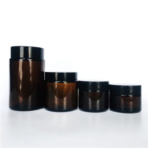 Custom 30ml 50ml 100ml 200ml amber glass cosmetic bottle for cream with black plastic cap