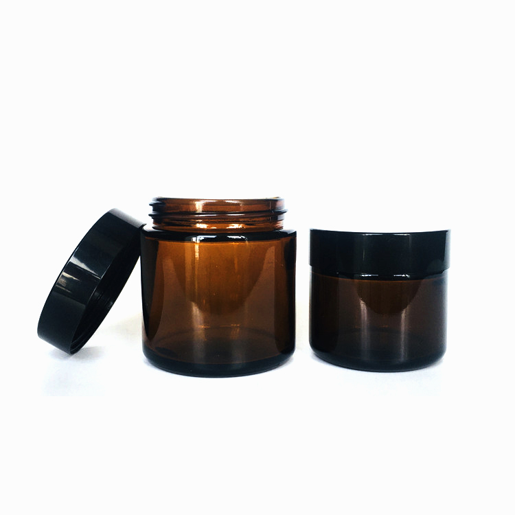 Custom 30ml 50ml 100ml 200ml amber glass cosmetic bottle for cream with black plastic cap