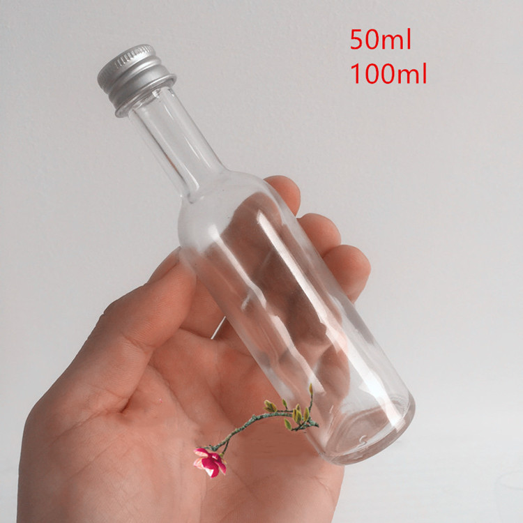 empty 50ml 100ml mini round glass liquor bottle with screw cap