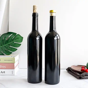 Manufacturer customize shinny black 750ml glass red wine bottles with cork