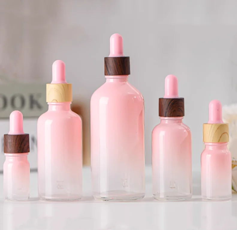 Customized pink color 5ml-100ml Skin care essential oil glass bottle with dropper for cosmetic packaging