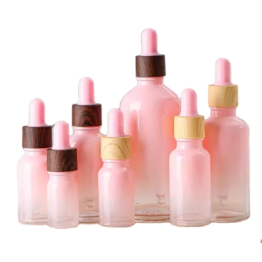 Customized pink color 5ml-100ml Skin care essential oil glass bottle with dropper for cosmetic packaging