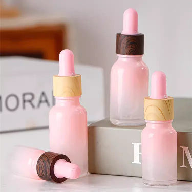 Customized pink color 5ml-100ml Skin care essential oil glass bottle with dropper for cosmetic packaging