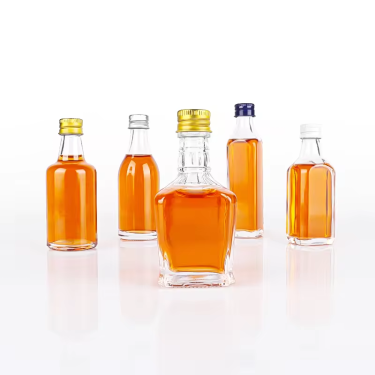 Wholesale mini 50ml creative transparent empty glass bottles portable glass bottles for beverage vodka spirit with lid