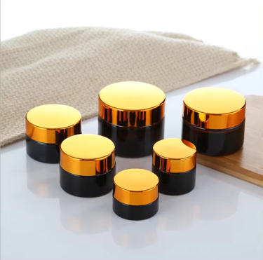 Wholesale 5g to 100g Amber Round Shape Eyes Care Face Care Essence Creams Cosmetic Glass Jar with Golden Black Lid