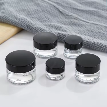 Wholesale 5ml to 100ml Round Shape Eyes Care Face Care Essence Creams Cosmetic Glass Jar with Golden Black Lid