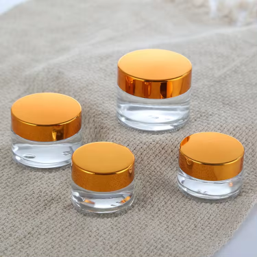 Wholesale 5ml to 100ml Round Shape Eyes Care Face Care Essence Creams Cosmetic Glass Jar with Golden Black Lid