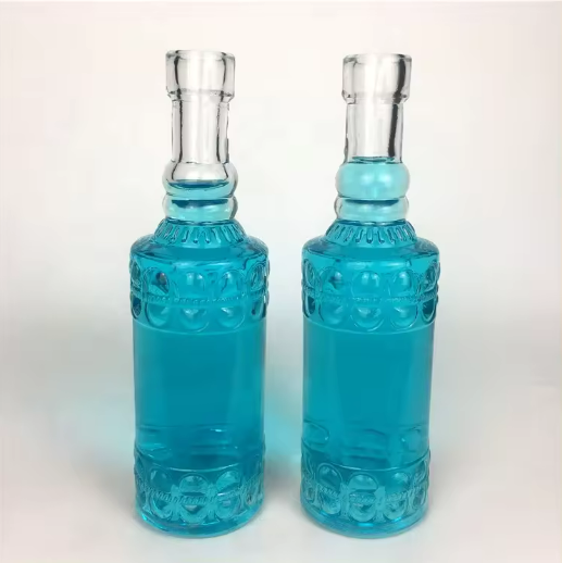 Wholesale 145ml empty emboss clear glass wine bottle for beverage