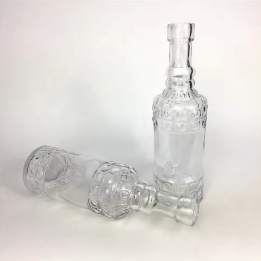 Wholesale 145ml empty emboss clear glass wine bottle for beverage