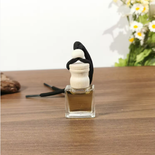 Empty 6ml 7ml 8ml custom logo printing glass car air freshener hanging perfume fragrance bottles with wooden caps diffuser