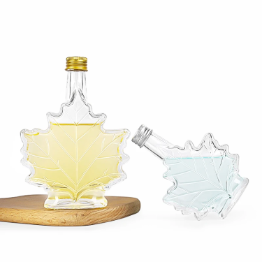 Maple leaf shaped glass beverage bottle