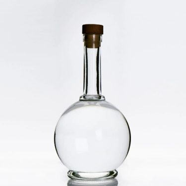 Factory wholesale 750ml gin glass bottle round shape vodka liquor bottle with cork custom logo 700ml whisky glass bottle