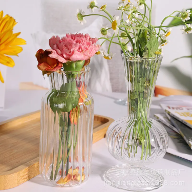 small vintage style transparent glass bud vase with ribbed line