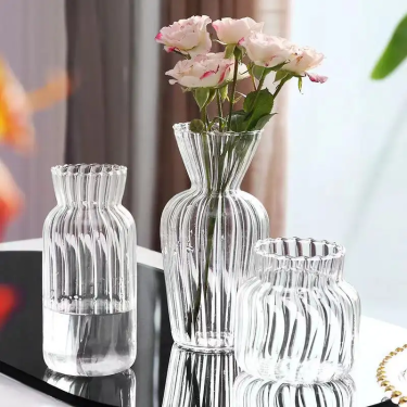 small vintage style transparent glass bud vase with ribbed line