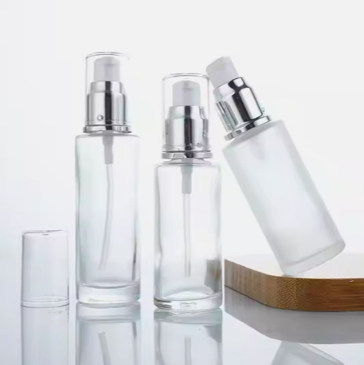 Wholesale luxury round skin care product packaging cosmetic glass lotion bottle with spray pump