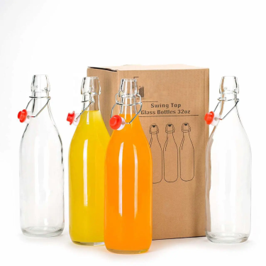 Various sizes clear glass beverage bottles for juice beer kombucha with swing tops