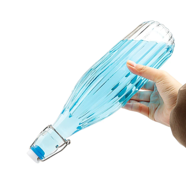 Wholesale 750ml 1000ml clear empty stripe pattern glass drinking bottle with swing top